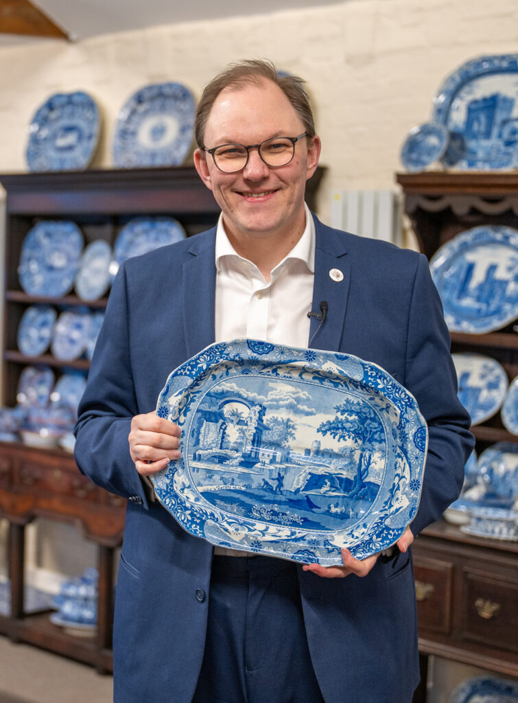 Gareth Snell MP holding a ceramic plate.